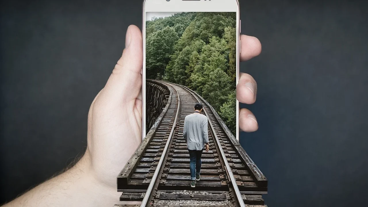 Hands Holding Phone Inspecting Phone